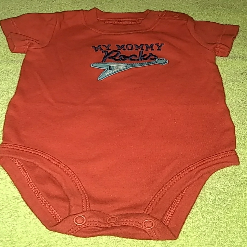 A red baby onesie